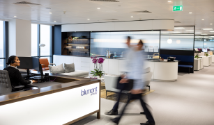 Blumont employees walking in the Blumont office
