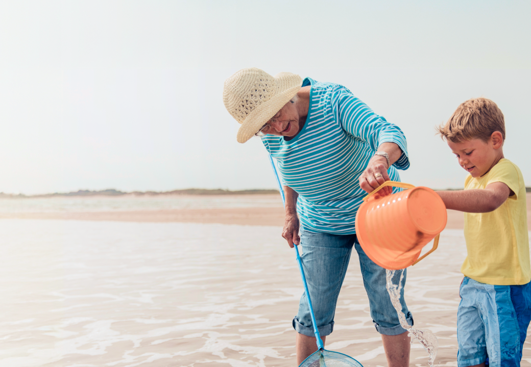 Grandmother and grandson at the beach